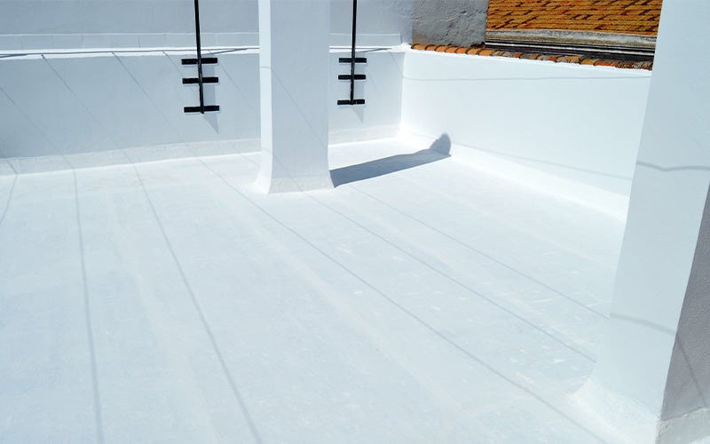 Bright white flat roof coating around a white column.